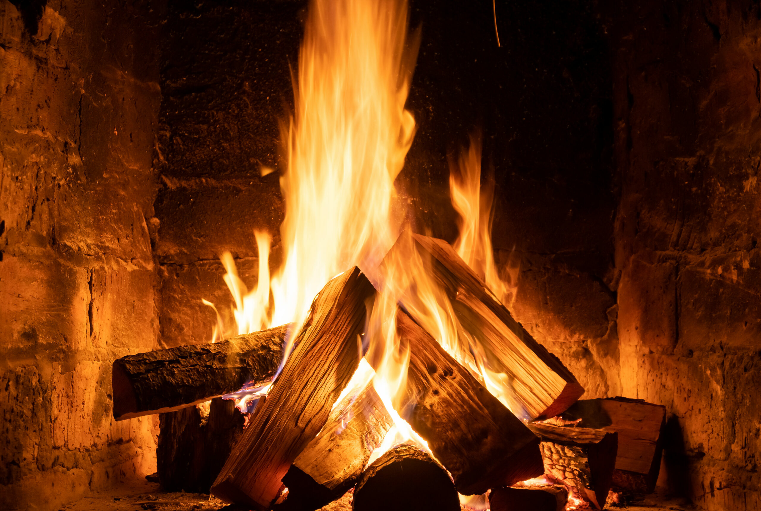 How to light a fire - well lit fireplace with logs